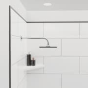 Close up of shower with FlexStyle black trim, block tile