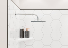 Close up of shower with FlexStyle black trim, hexagon tile