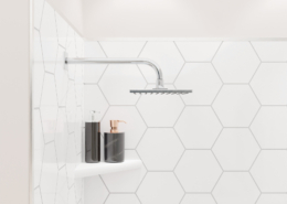 Close up of shower with FlexStyle nickel trim, hexagon tile