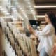 Person at store looking through shower tile samples